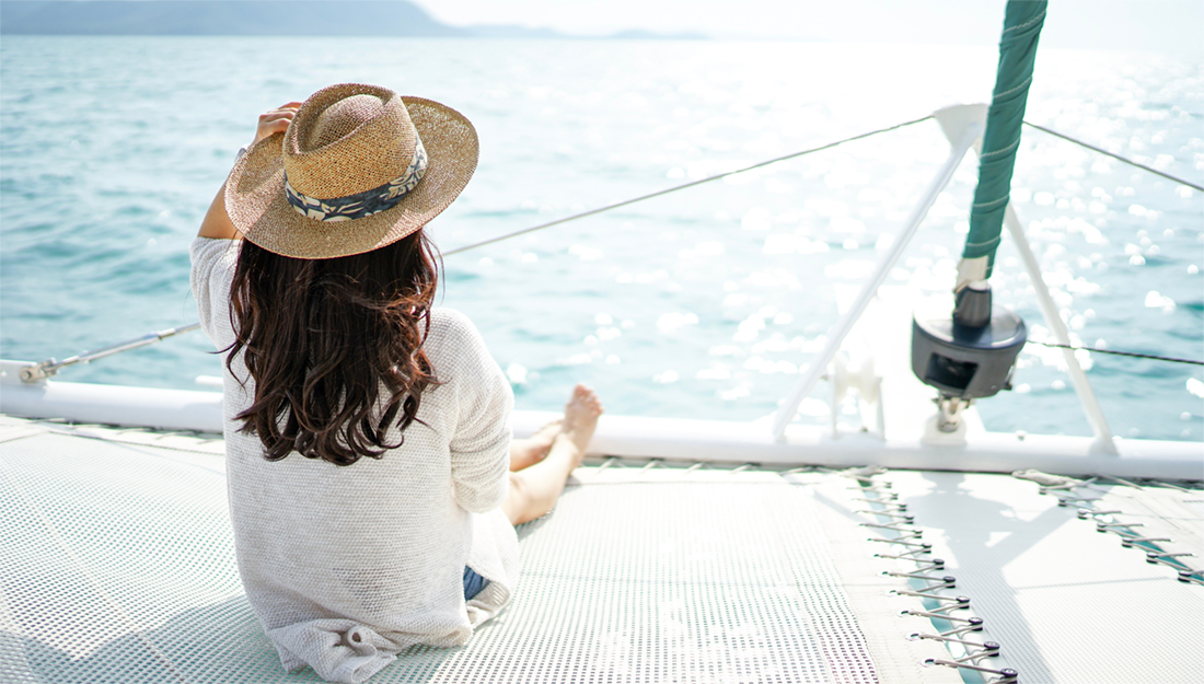 A woman on a catamaran