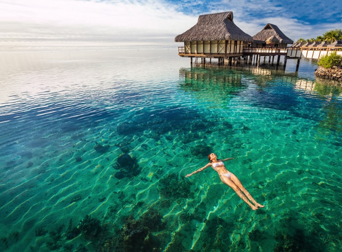 A woman swimming in Tahiti