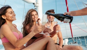 People drinking champagne on a boat